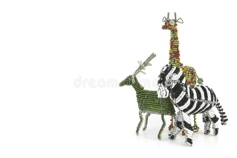 Wired and beaded African animal craft of a Giraffe, Zebra and Buck isolated on a white background. Wired and beaded African animal craft of a Giraffe, Zebra and Buck isolated on a white background