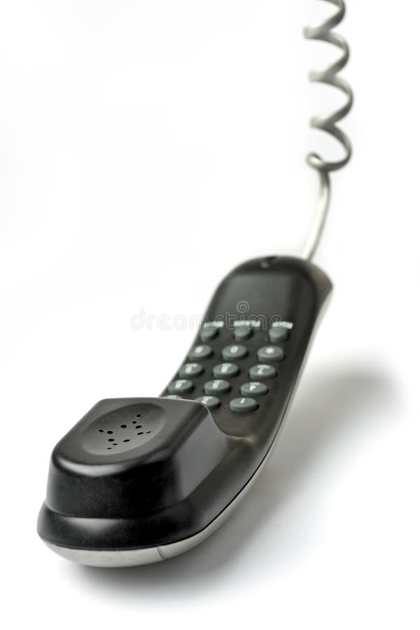 Wired telephone against white background