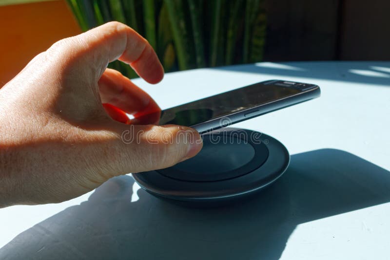 Wireless charging device stock photo. Image of lifting 176655450