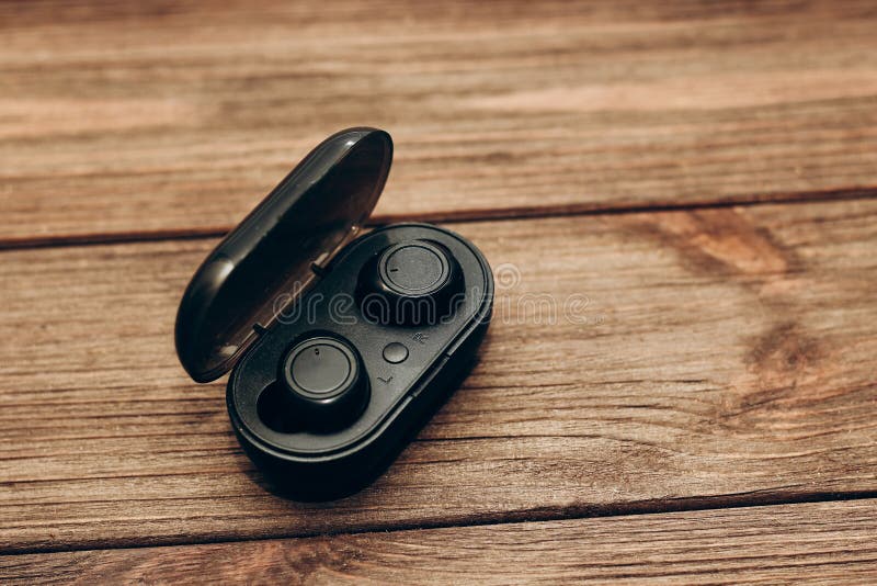 Wireless Headphones in a Black Box on the Table. Stock Photo Image of