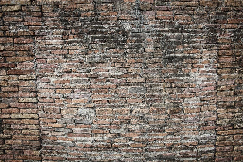 Wirkliche mittelalterliche Backsteinmaueroberfläche kann als Hintergrundmuster oder -beschaffenheit mit wirklichem Licht an der a lizenzfreie stockbilder Wirkliche mittelalterliche Backsteinmaueroberfläche kann als Hintergrundmuster oder -beschaffenheit mit wirklichem Licht an der a lizenzfreie stockbilder