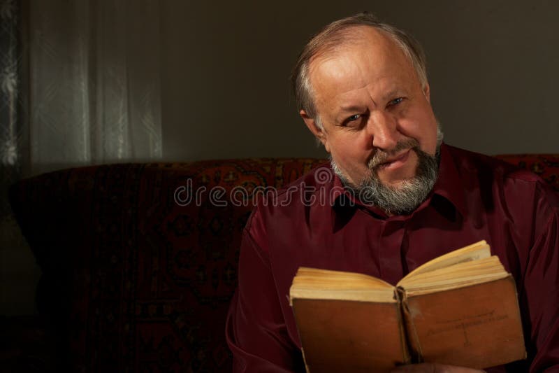 Wise man behind reading by the book