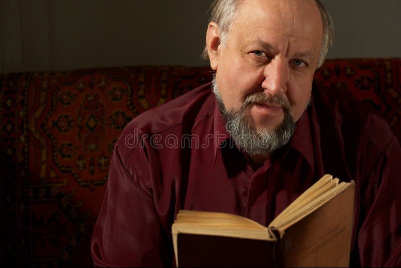 Wise man behind reading by the book