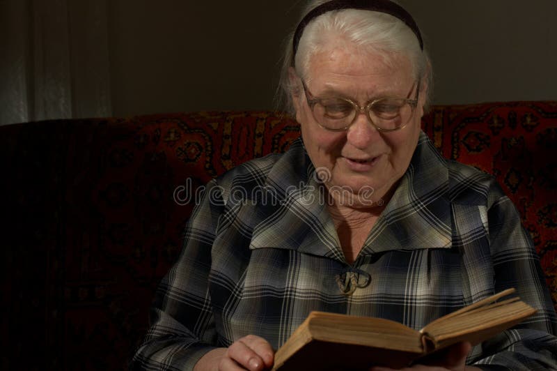 Wise woman behind reading by the book