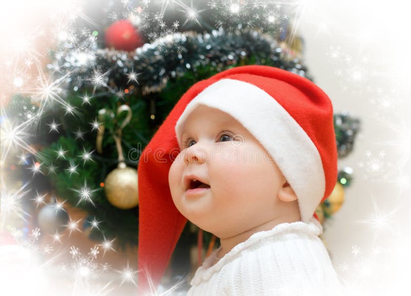 Wishing girl in red Santa hat