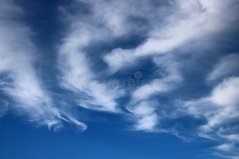 Wispy White Clouds Against a Blue Sky Stock Image - Image of clouds,  shapes: 184348219