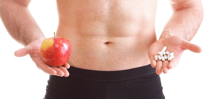 Natural apple vitamin or pill drag tablet Man isolated offering pill in one and pills in bottle - in another hand. Copy space boxes with supplements. Natural apple vitamin or pill drag tablet Man isolated offering pill in one and pills in bottle - in another hand. Copy space boxes with supplements