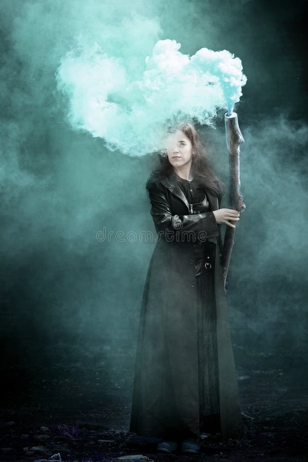 Witch in blue smoke stock photo. Image of halloween 166222730