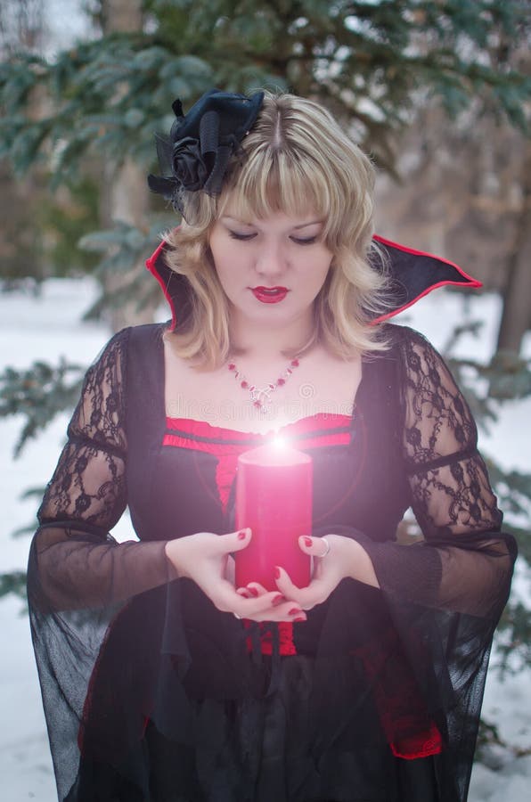 Witch with candle royalty free stock image