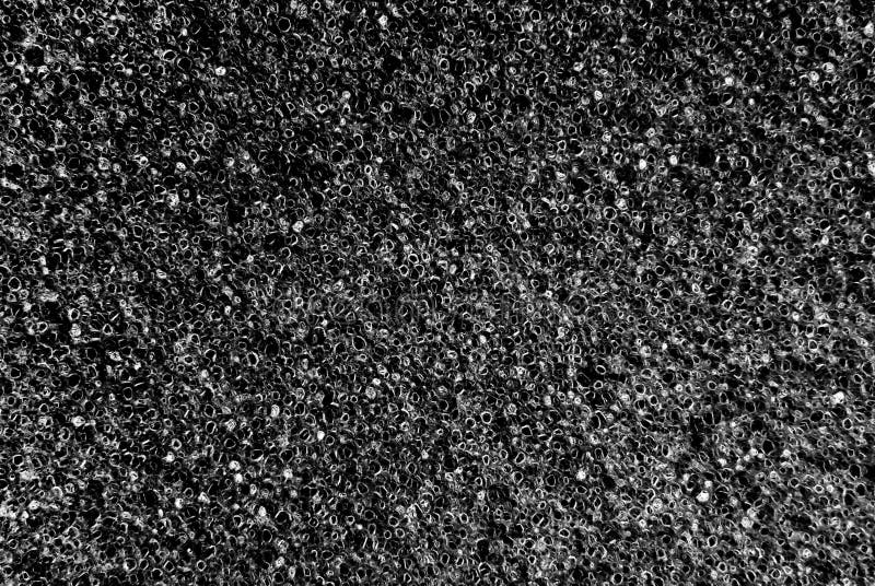 Witte en zwarte poreuze textuurachtergrond royalty-vrije stock foto