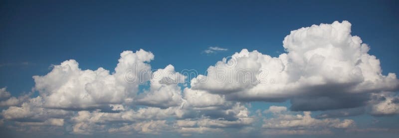 White fluffy clouds in the blue sky. White fluffy clouds in the blue sky