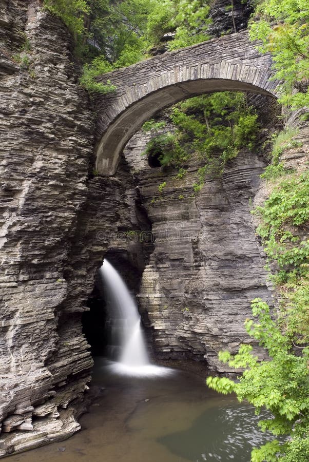 Watkins Glen state park in New York. The gorge trail and stone bridges where constructed in the 1930's and blend in amazingly well with the natural surroundings of the gorge. Its hard to tell where the man made walls start and end, quite an accomplishment. Watkins Glen state park in New York. The gorge trail and stone bridges where constructed in the 1930's and blend in amazingly well with the natural surroundings of the gorge. Its hard to tell where the man made walls start and end, quite an accomplishment.