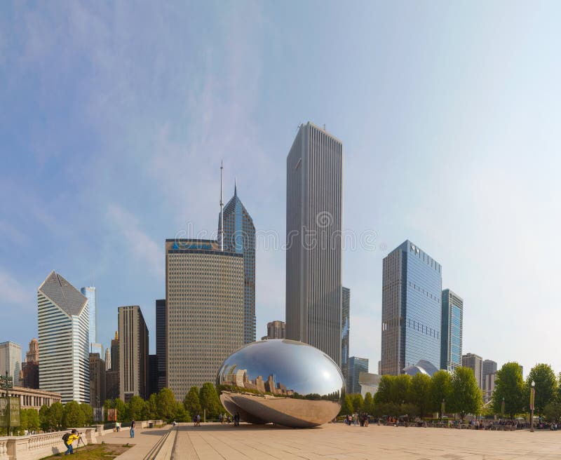 CHICAGO - MAY 18: Cloud Gate sculpture in Millenium park on May 18, 2013 in Chicago, IL. It's a public sculpture by Indian-born British artist Anish Kapoor, is the centerpiece of the AT&T Plaza in Millennium Park within the Loop community area of Chicago, Illinois, United States. CHICAGO - MAY 18: Cloud Gate sculpture in Millenium park on May 18, 2013 in Chicago, IL. It's a public sculpture by Indian-born British artist Anish Kapoor, is the centerpiece of the AT&T Plaza in Millennium Park within the Loop community area of Chicago, Illinois, United States.