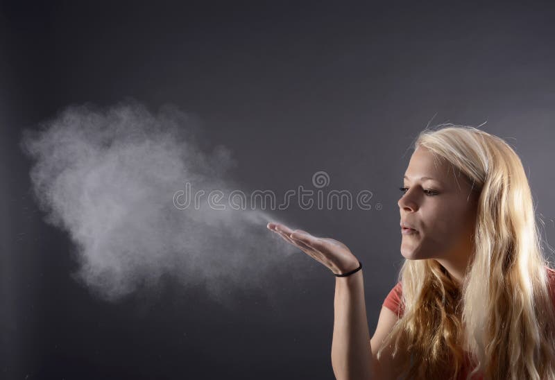 Woman blowing powder stock photo. Image of shot, floating 34804210