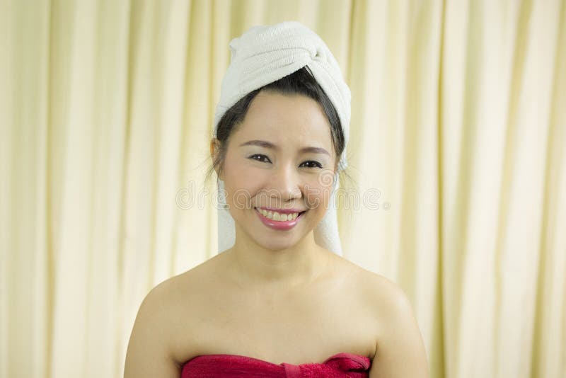 Woman acting smile, sad, funny, wear a skirt to cover her breast after wash hair, Wrapped in Towels After Shower royalty free stock images Woman acting smile, sad, funny, wear a skirt to cover her breast after wash hair, Wrapped in Towels After Shower royalty free stock images