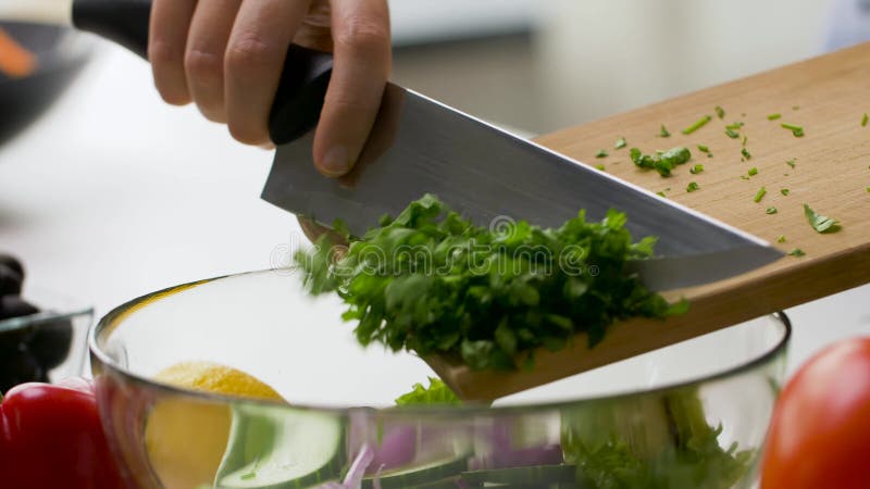 Adding Chopped Garlic into a Bowl of Grated Potato. POV Cooking Hash ...