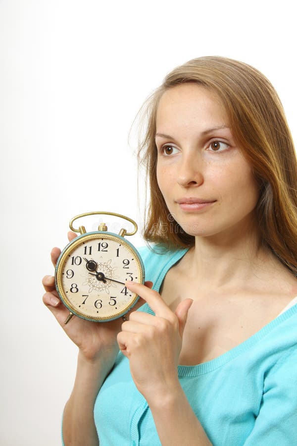 Woman with alarm clock stock photo. Image of holding 31065742