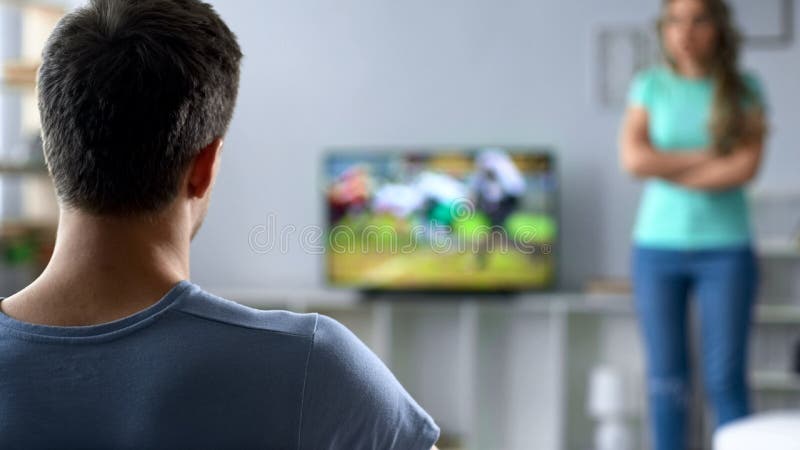 Annoyed Girlfriend Waiting for Boyfriend To Stop Playing Video-games Stock  Photo - Image of game, gamer: 100430632