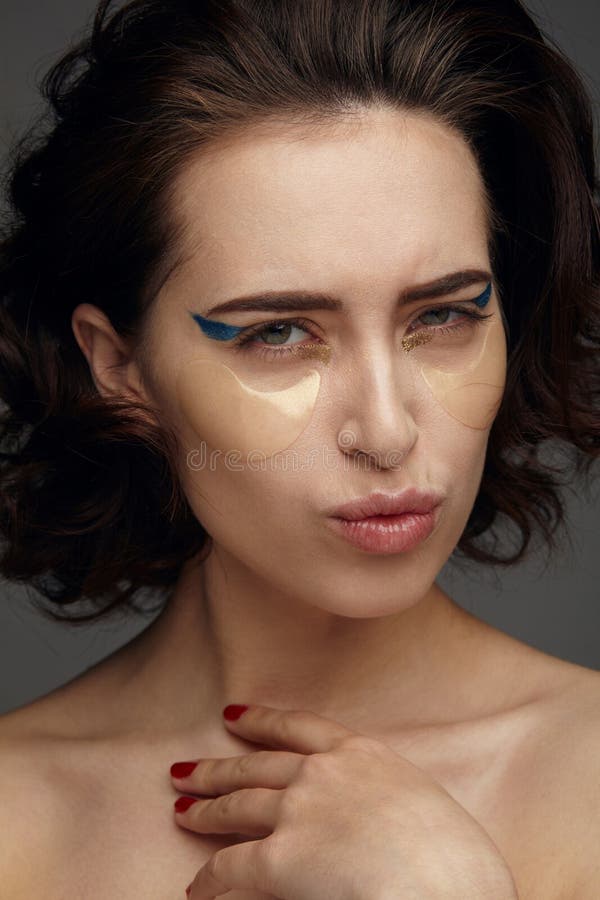 Woman applying eye mask stock photo. Image of relaxation 92868620