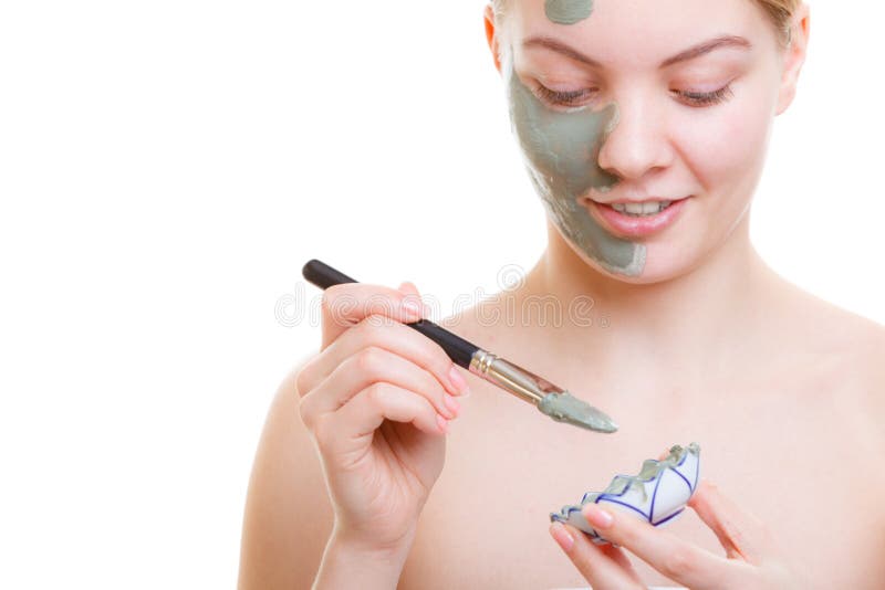 Woman applying face mask with brush royalty free stock image Woman applying face mask with brush royalty free stock image