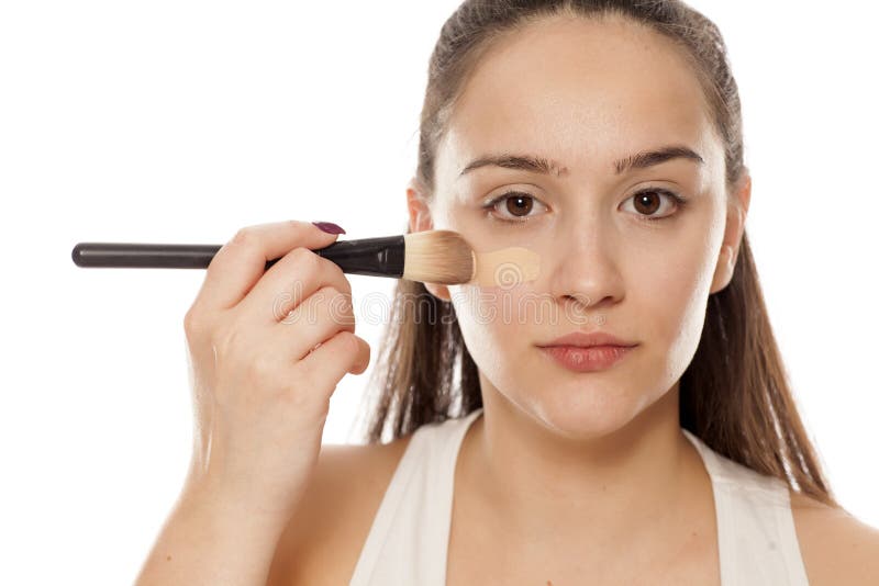 Woman Applying Liquid Foundation Stock Photo - Image of care, portrait ...