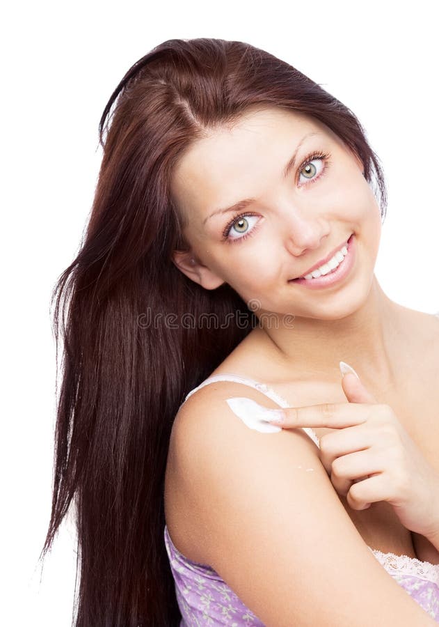 Woman applying lotion stock photo. Image of girl, female 19718842