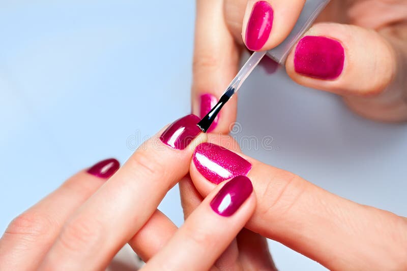 Woman Applying Nail Varnish To Finger Nails Stock Photo - Image of bottle,  fingernail: 38216072