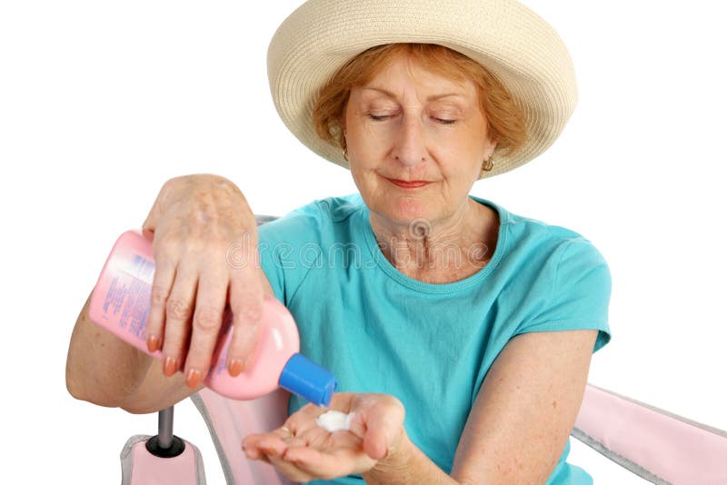 Woman applying sunscreen