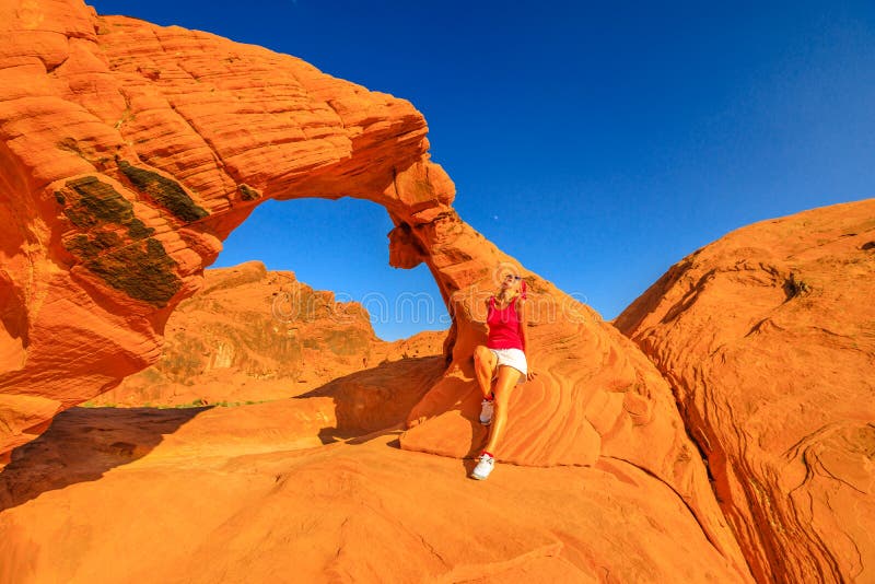 Woman and sandstone arch stock photo. Image of arches 19825320