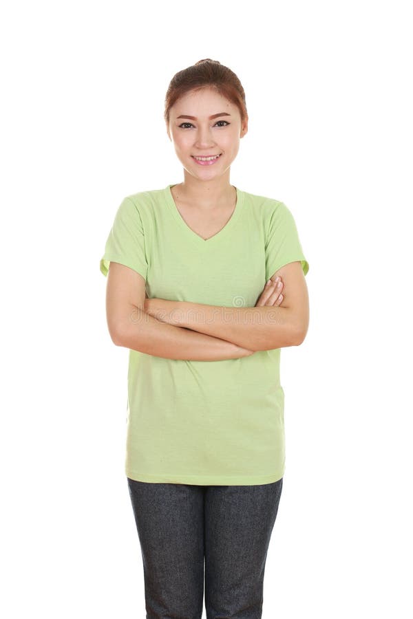 Woman with arms crossed, wearing green t-shirt isolated on white background. Woman with arms crossed, wearing green t-shirt isolated on white background.