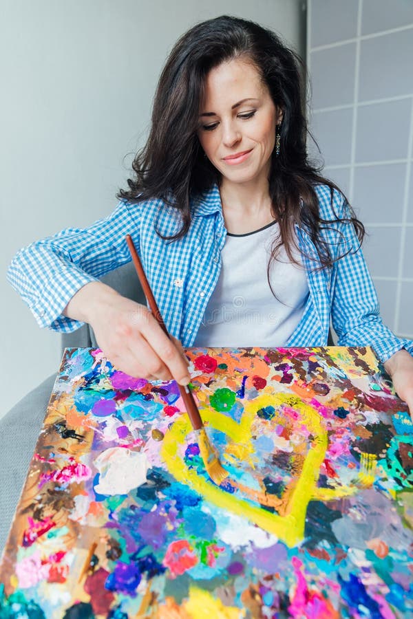 Woman Artist with Brush and Palette in the Art Studio Stock Image
