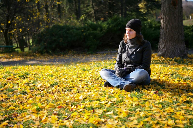 Woman on the autumn leaves