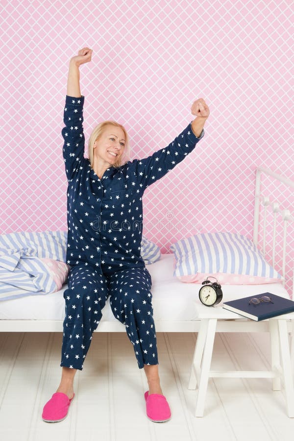 Woman stretching after awakening in the morning. Woman stretching after awakening in the morning