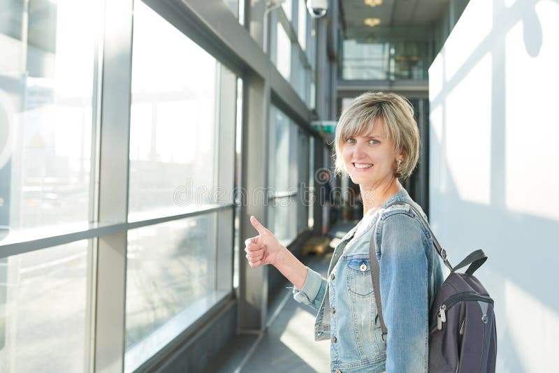 Woman with backpack going on boarding