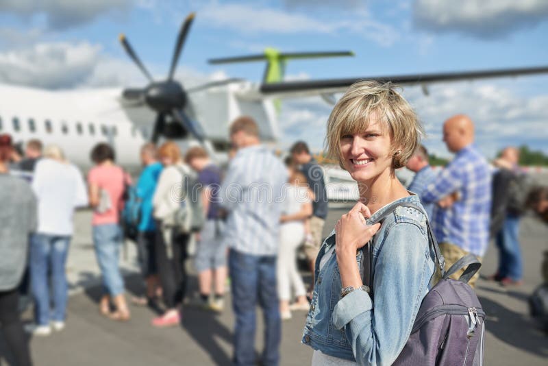 Woman with backpack going on boarding