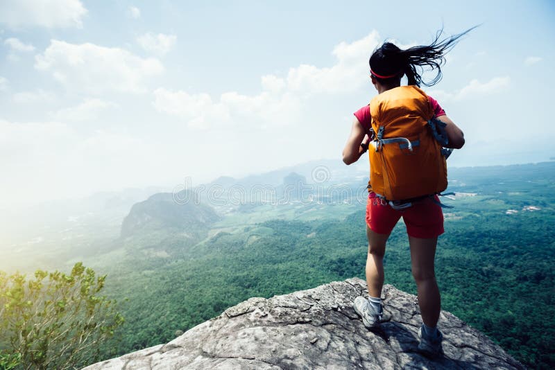 Woman with Backpacker Hiking at Seaside Mountain Cliff Edge Stock Image ...