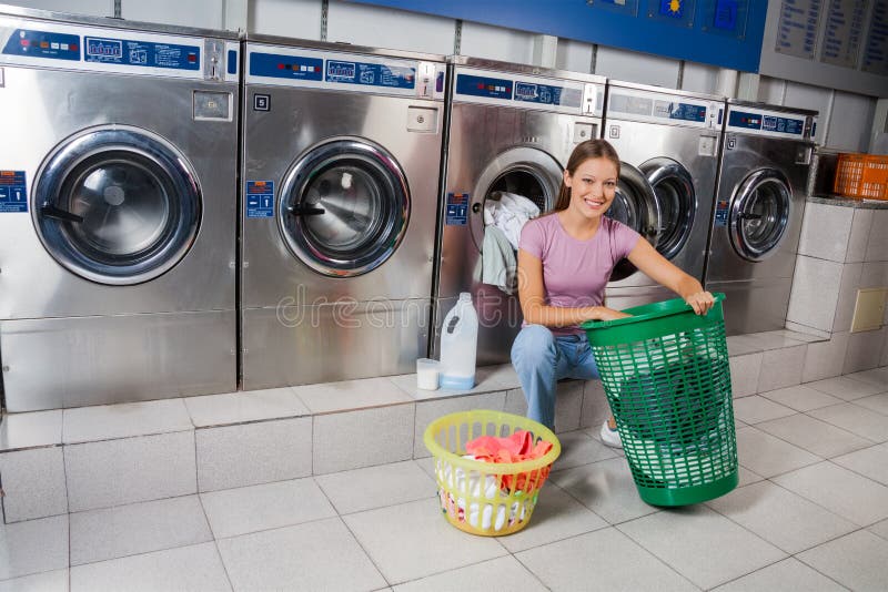 Woman With Baskets Of Clothes At Laundry stock photography Woman With Baskets Of Clothes At Laundry stock photography
