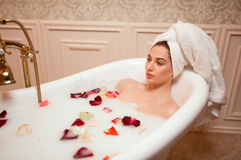 Woman in Bathroom with Rose Petals Stock Image Image of bubble