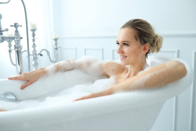 Woman in a bathtub stock photo. Image of hygiene, bath 144613450
