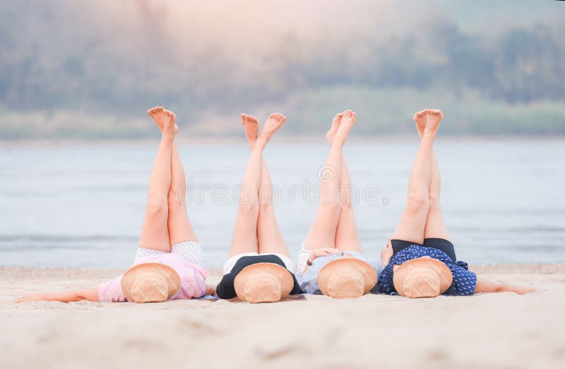 Woman On The Beach Relaxing Concept Four Women Lying On Sand Tropical