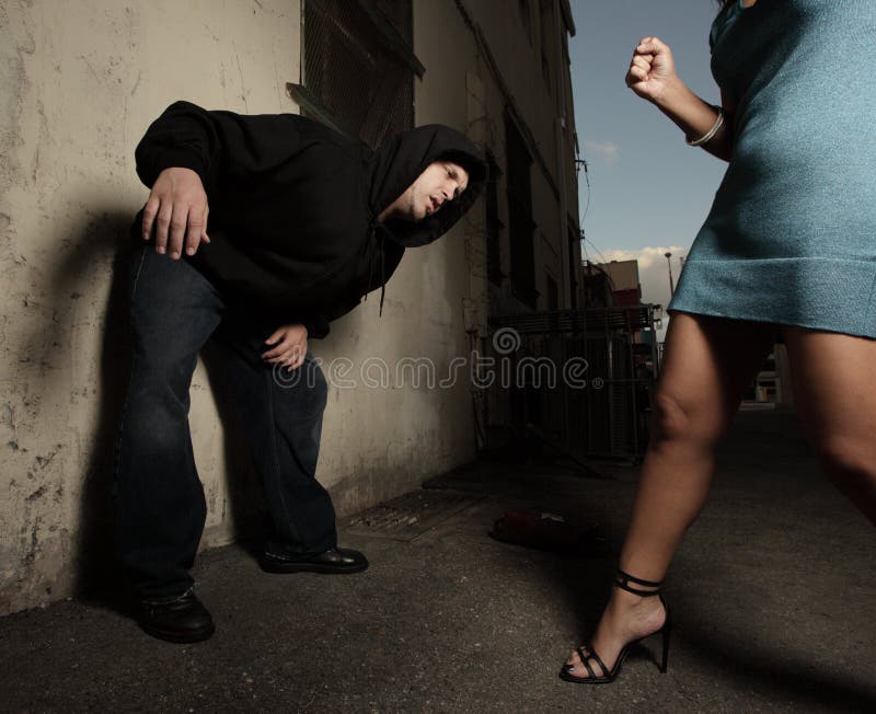 Woman beating up the assailant