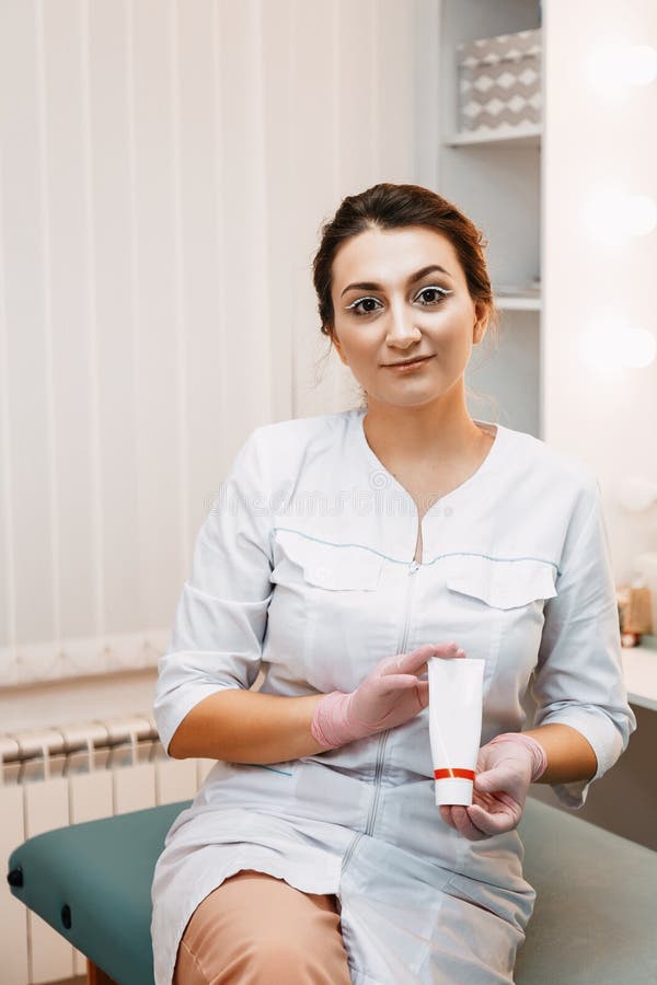 Woman beautician doctor at work in spa center. Portrait of a young female professional cosmetologist stock photos Woman beautician doctor at work in spa center. Portrait of a young female professional cosmetologist stock photos