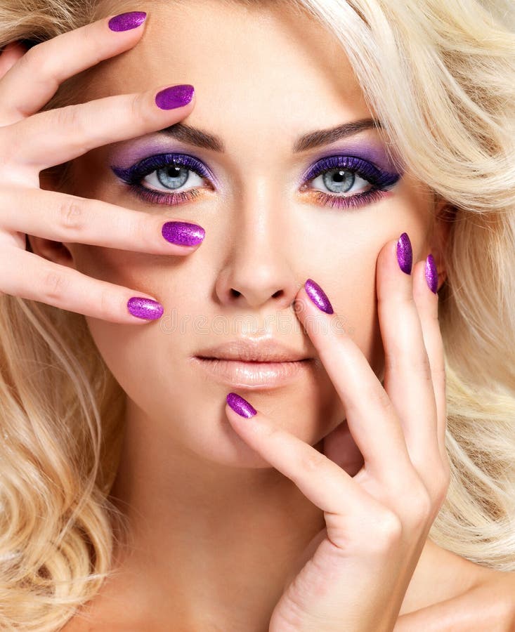 Woman with beautiful nails and eye makeup