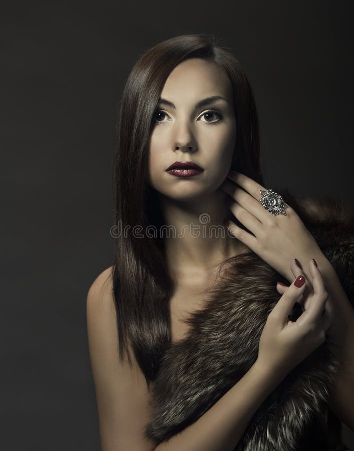 Woman beauty portrait, beautiful girl in fox fur