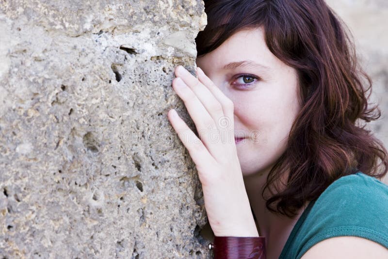 Woman behind wall