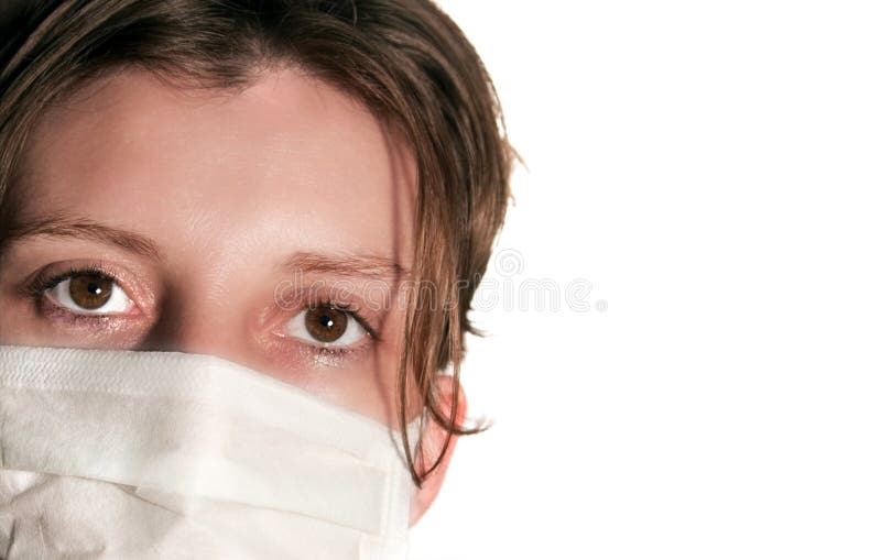 Woman with big green eyes wearing medical mask royalty free stock image Woman with big green eyes wearing medical mask royalty free stock image