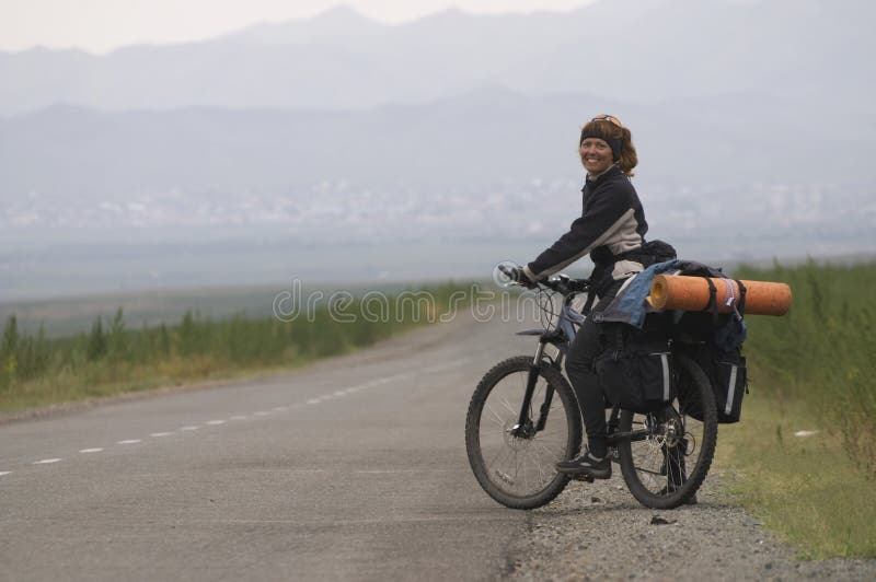 Woman biker on a road