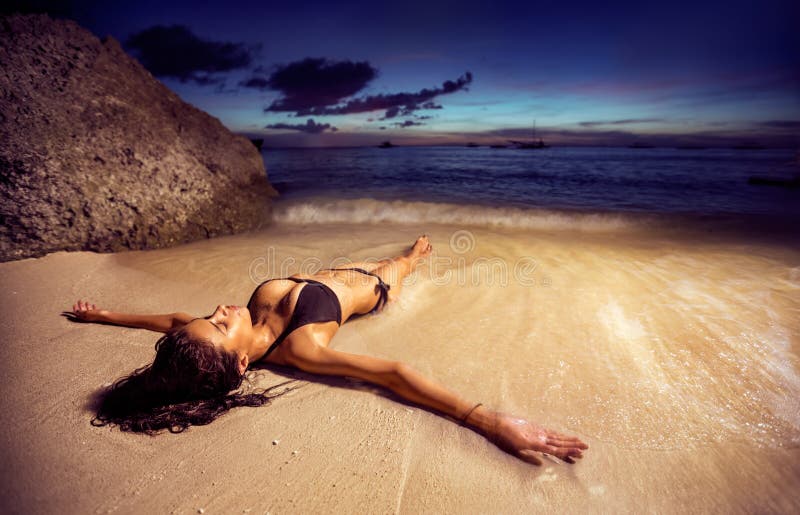 Woman in bikini on the beach at sunset royalty free stock images Woman in bikini on the beach at sunset royalty free stock images