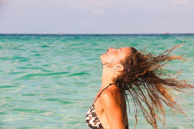 Woman in Bikini Pulling Her Wet Hair Backwards on the Sea Stock Image ...
