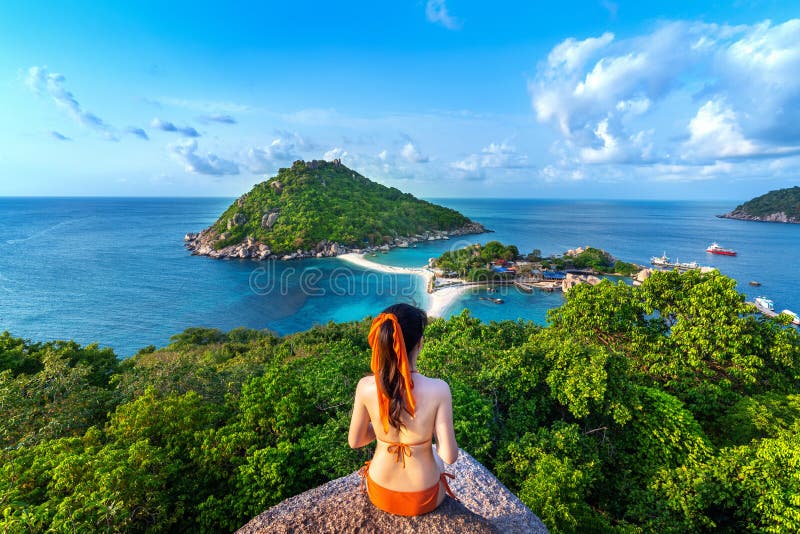 Woman in bikini sitting at the viewpoint of Nang yuan island, Thailand